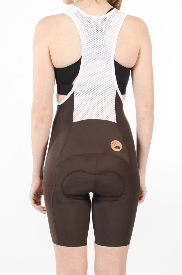 Back view of women's Velocity 2.0 Cycling Bib Shorts. Brown aerodynamic cycling shorts with mesh back panel for ventilation.