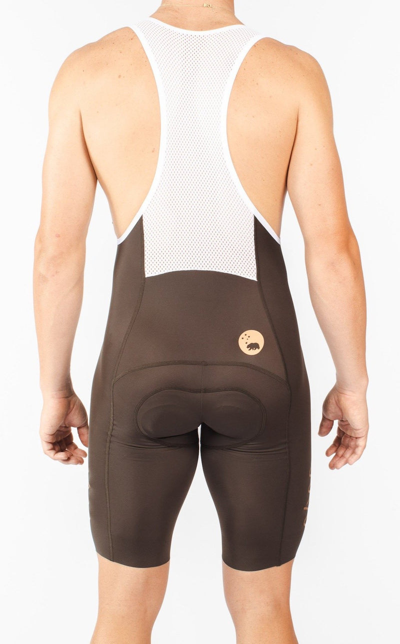 Back view of men's Velocity 2.0 Cycling Bib Shorts. Brown aerodynamic cycling shorts with mesh back panel for ventilation.
